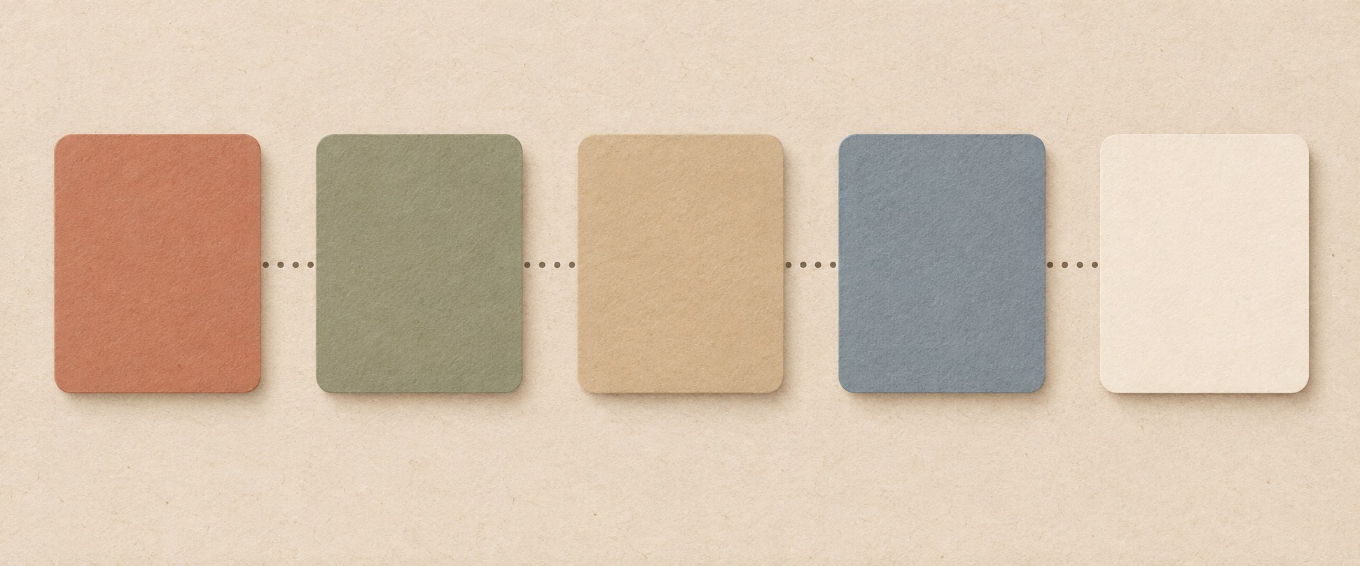 Five blank cards in a row on a desk, suggesting a sequence from brief to publish, with no readable text