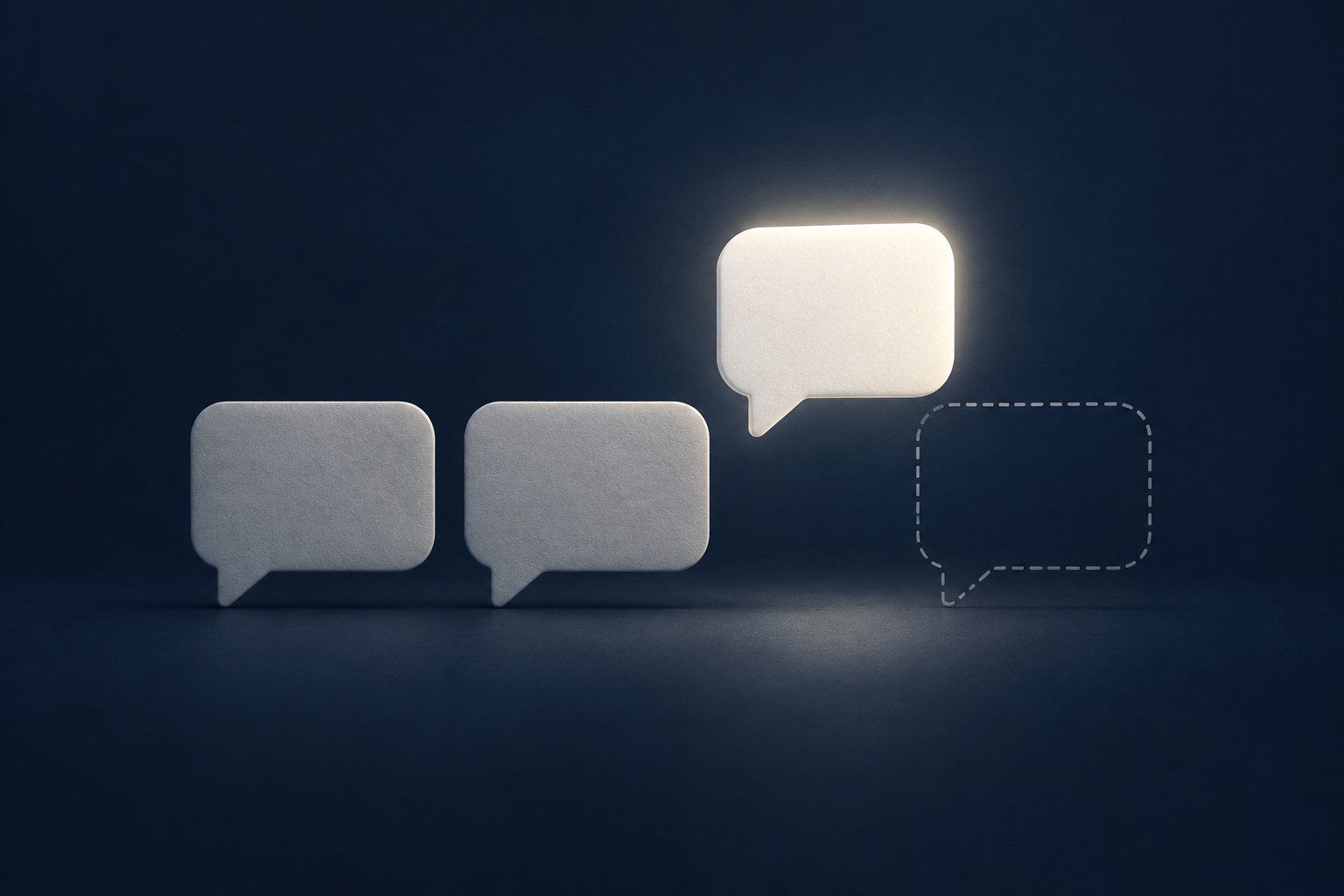Editorial still life of one speech bubble being lifted off a dark navy surface, with no lettering and no phone screen