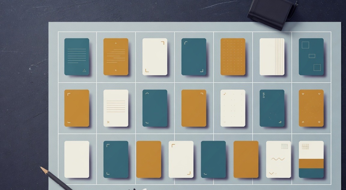 A clean weekly posting schedule grid spread across a desk with content type cards arranged by day and platform